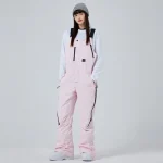 salopette de snowboard rose pour femme résistante à l'eau